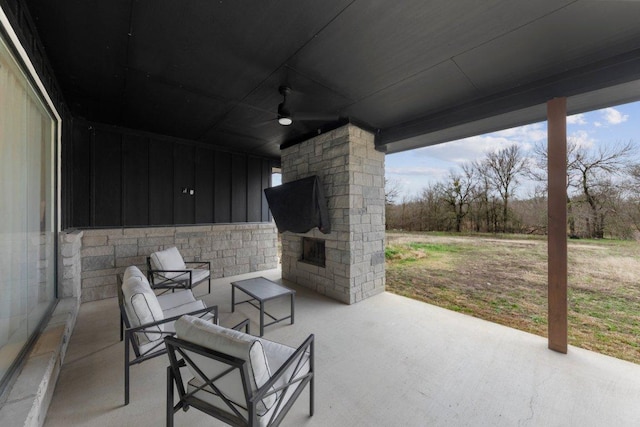 7143 Kc Ranch Ct, Temple, TX 76501 - view of patio with an outdoor stone fireplace and a ceiling fan