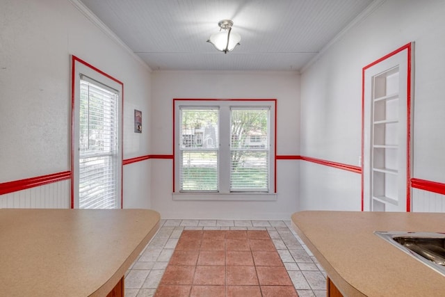 700 S Walnut Ave, Luling, TX 78648 - unfurnished dining area with ornamental molding and light tile patterned flooring