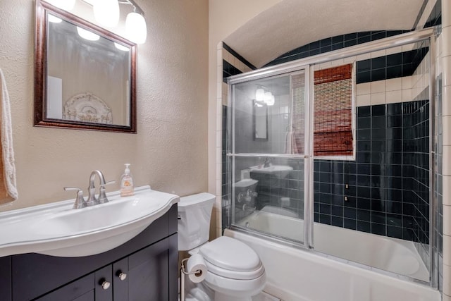 700 S Walnut Ave, Luling, TX 78648 - full bathroom featuring a textured wall, bath / shower combo with glass door, and vanity