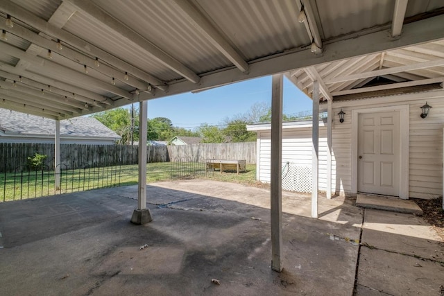 700 S Walnut Ave, Luling, TX 78648 - fenced backyard with a patio area