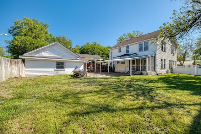 700 S Walnut Ave, Luling, TX 78648 - rear view of property with a fenced backyard, a patio area, and a sunroom