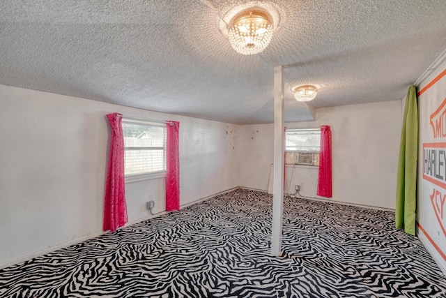700 S Walnut Ave, Luling, TX 78648 - empty room featuring carpet floors and a textured ceiling