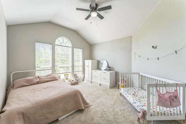 carpeted bedroom with ceiling fan and lofted ceiling