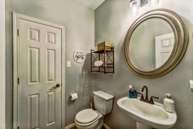 1515 Kothman Dr, Hutto, TX 78634 - half bath featuring a sink and toilet