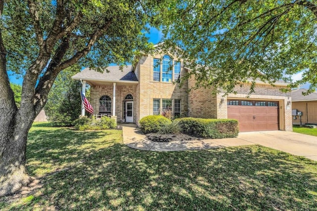 1515 Kothman Dr, Hutto, TX 78634 - traditional home with concrete driveway, a front lawn, brick siding, and a garage