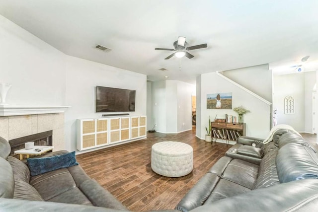 1515 Kothman Dr, Hutto, TX 78634 - living area featuring ceiling fan, wood finished floors, and a fireplace