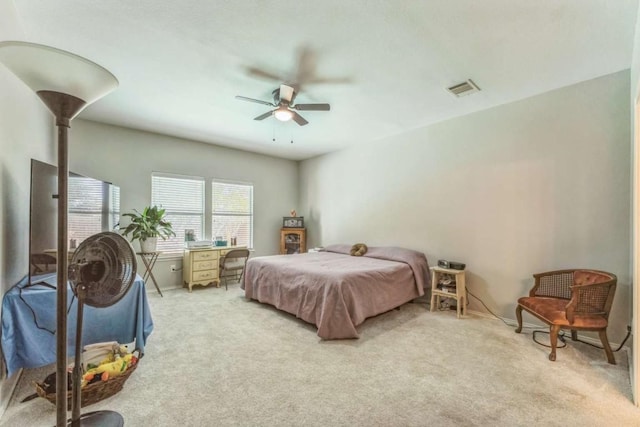 1515 Kothman Dr, Hutto, TX 78634 - bedroom with light carpet, a ceiling fan, and baseboards