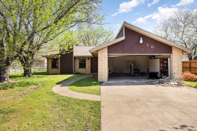 810 San Jacinto St, Lockhart, TX 78644 - view of front of property with driveway and brick siding