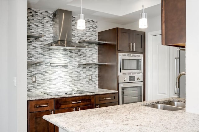 6000 Shepherd Mountain Cv Unit 407, Austin, TX 78730 - kitchen with appliances with stainless steel finishes, open shelves, a sink, wall chimney range hood, and tasteful backsplash