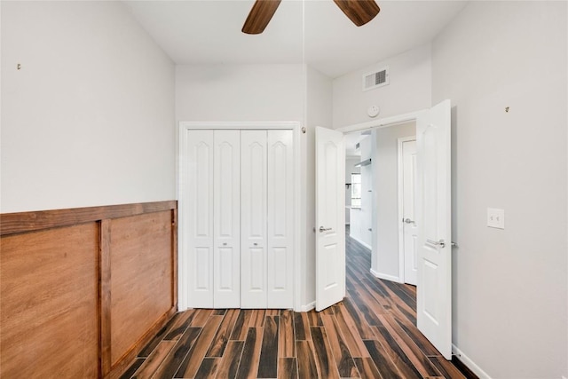 6000 Shepherd Mountain Cv Unit 407, Austin, TX 78730 - unfurnished bedroom with dark wood-type flooring, a closet, baseboards, and ceiling fan