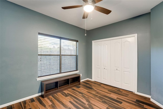 6000 Shepherd Mountain Cv Unit 407, Austin, TX 78730 - unfurnished bedroom featuring dark wood finished floors, baseboards, a closet, and ceiling fan