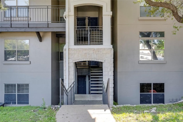 6000 Shepherd Mountain Cv Unit 407, Austin, TX 78730 - doorway to property featuring stucco siding, stone siding, and a balcony