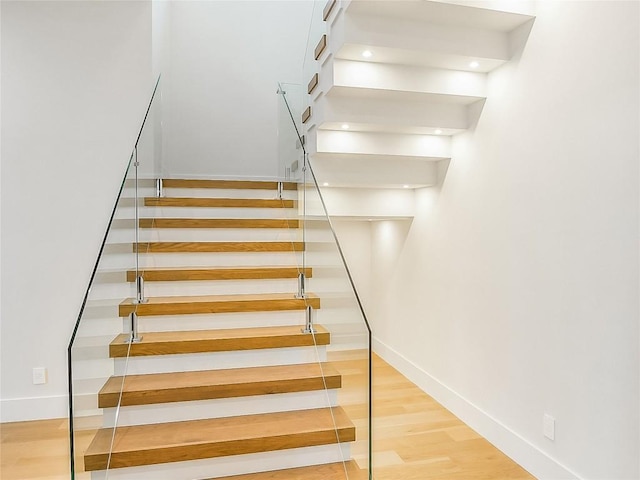 4800 Mondonedo Cv, Austin, TX 78738 - stairway with baseboards and wood finished floors