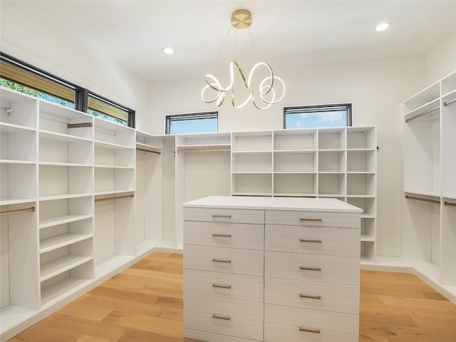 4800 Mondonedo Cv, Austin, TX 78738 - spacious closet with light wood-style floors and a chandelier