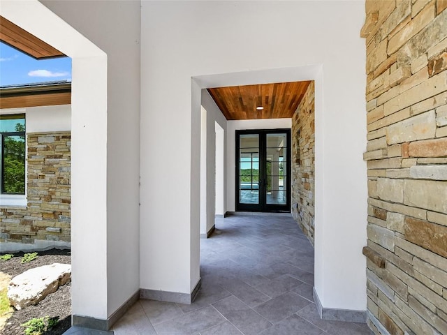 4800 Mondonedo Cv, Austin, TX 78738 - entrance to property featuring stone siding, french doors, and stucco siding