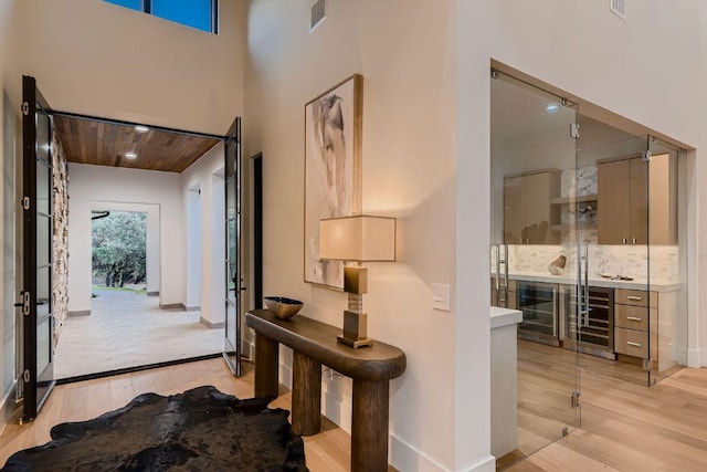 4800 Mondonedo Cv, Austin, TX 78738 - foyer with light wood finished floors, baseboards, and wooden ceiling