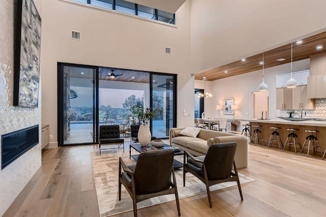 4800 Mondonedo Cv, Austin, TX 78738 - living area with light wood-style floors and a high ceiling