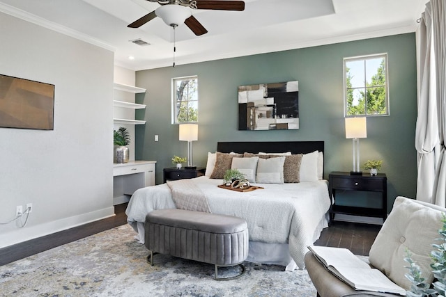 5200 Patagonia Pass, Austin, TX 78738 - bedroom with wood finished floors, ornamental molding, baseboards, multiple windows, and a raised ceiling