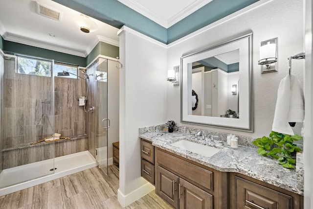 5200 Patagonia Pass, Austin, TX 78738 - full bathroom featuring vanity, a stall shower, crown molding, wood finished floors, and baseboards