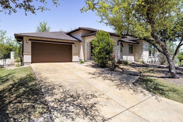 5200 Patagonia Pass, Austin, TX 78738 - ranch-style house featuring stucco siding, an attached garage, driveway, a tile roof, and stone siding