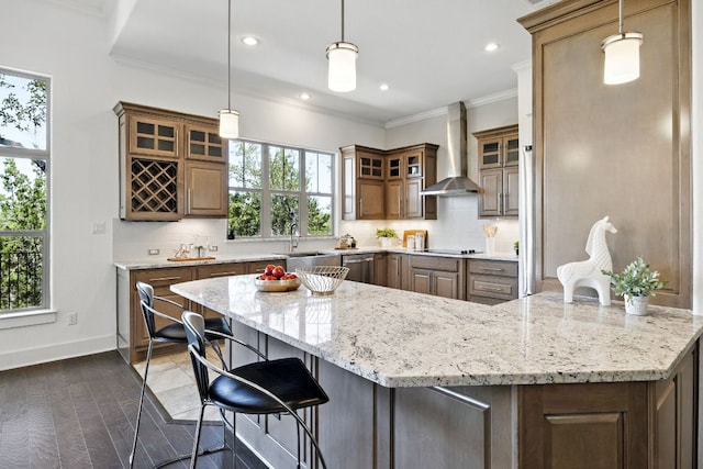 5200 Patagonia Pass, Austin, TX 78738 - kitchen with wall chimney range hood, tasteful backsplash, ornamental molding, a sink, and light stone counters