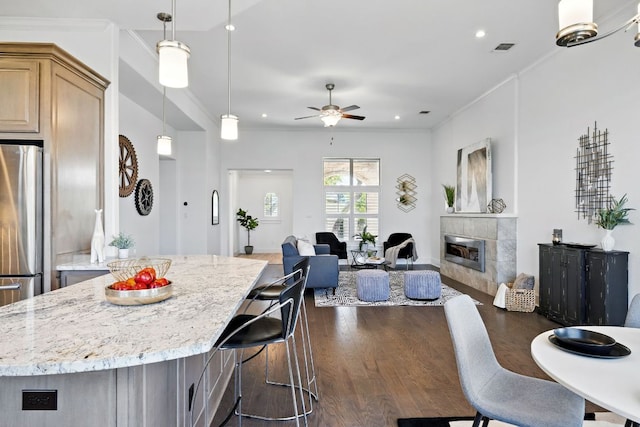 5200 Patagonia Pass, Austin, TX 78738 - kitchen featuring freestanding refrigerator, a ceiling fan, crown molding, open floor plan, and dark wood finished floors