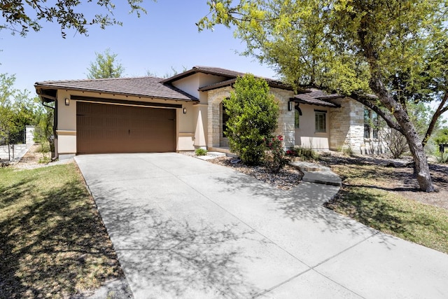 5200 Patagonia Pass, Austin, TX 78738 - ranch-style house featuring stucco siding, a tiled roof, an attached garage, concrete driveway, and stone siding