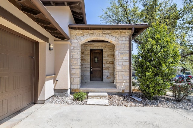 5200 Patagonia Pass, Austin, TX 78738 - view of exterior entry featuring stone siding and stucco siding