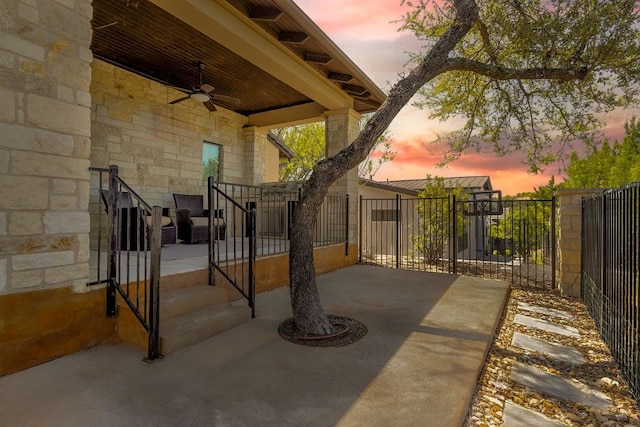 5200 Patagonia Pass, Austin, TX 78738 - patio terrace at dusk with a ceiling fan and a gate