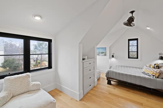 802 Pressler St, Austin, TX 78703 - bedroom with lofted ceiling, light wood-style floors, and baseboards