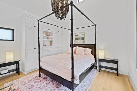 802 Pressler St, Austin, TX 78703 - bedroom with light wood-style floors, a chandelier, multiple windows, and baseboards