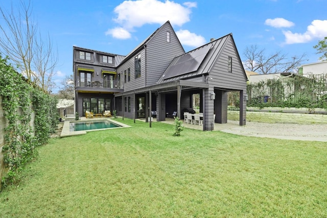 802 Pressler St, Austin, TX 78703 - back of property featuring a balcony, a yard, a patio, and an outdoor pool