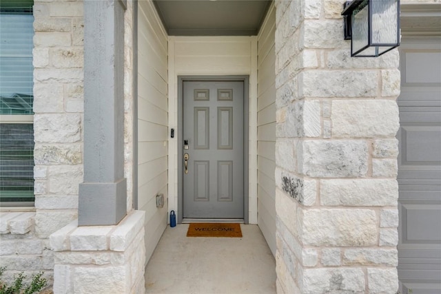 entrance to property with stone siding