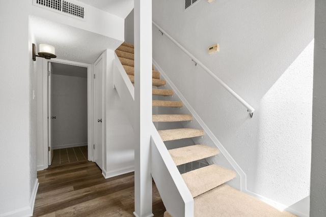 8902 Trone Cir Unit A, Austin, TX 78758 - stairs featuring wood finished floors and baseboards