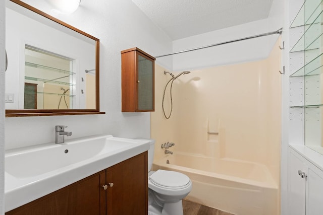 8902 Trone Cir Unit A, Austin, TX 78758 - full bathroom with vanity, shower / bath combination, wood finished floors, and a textured ceiling