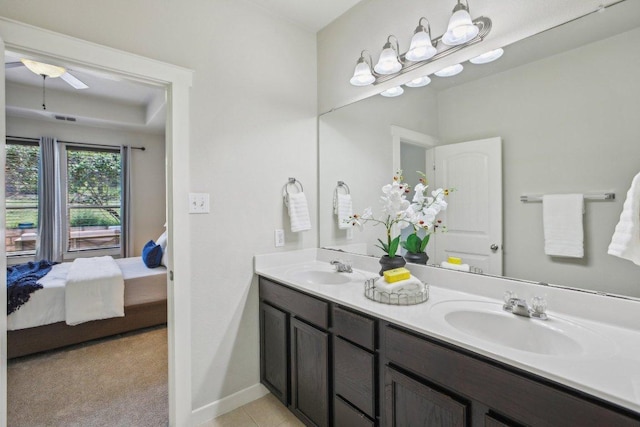 2001 Faro Dr Unit 29, Austin, TX 78741 - full bath featuring double vanity, a sink, connected bathroom, and ceiling fan