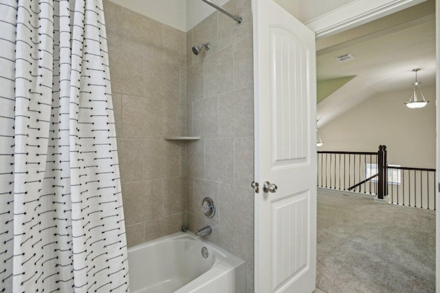 2001 Faro Dr Unit 29, Austin, TX 78741 - full bath featuring visible vents, shower / bath combo, and vaulted ceiling