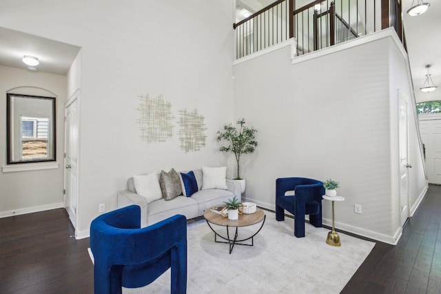 2001 Faro Dr Unit 29, Austin, TX 78741 - living room with baseboards, a high ceiling, and wood finished floors