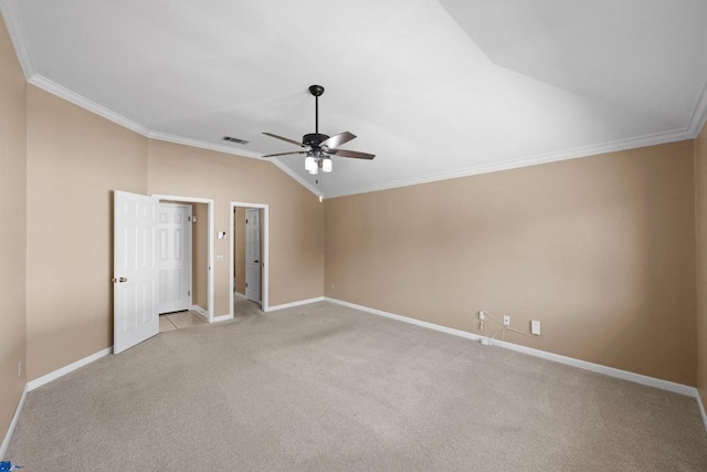 unfurnished bedroom with visible vents, baseboards, lofted ceiling, ornamental molding, and light carpet