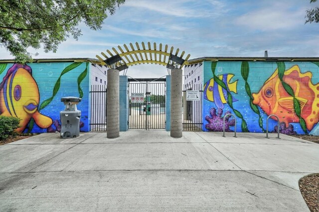 view of gate with fence