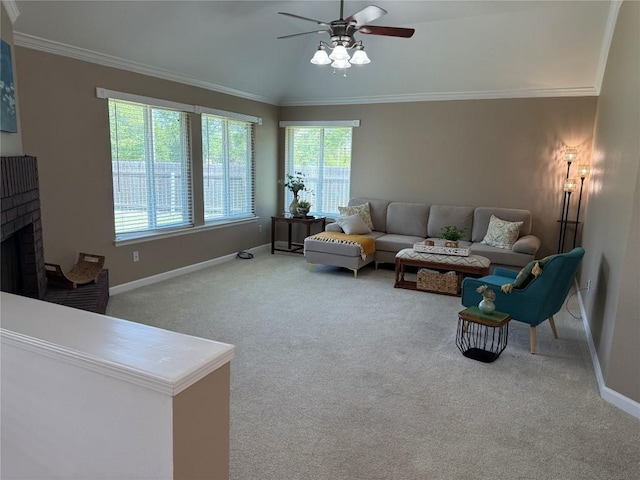 living area with crown molding, carpet flooring, baseboards, and ceiling fan