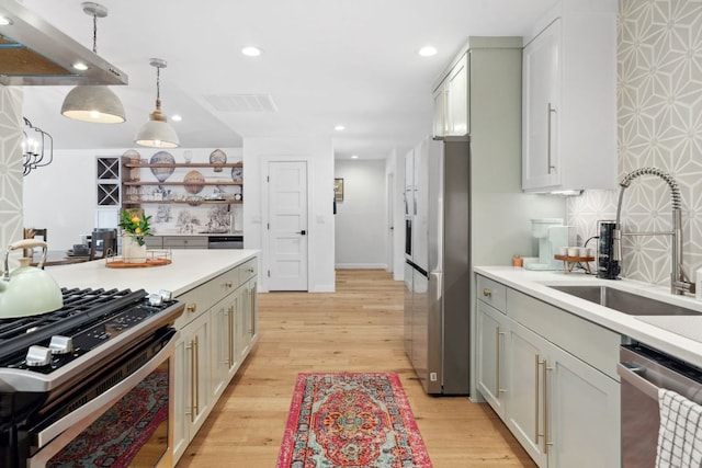 1803 Cedar Ridge Dr, Austin, TX 78741 - kitchen with stainless steel appliances, a sink, recessed lighting, light countertops, and backsplash