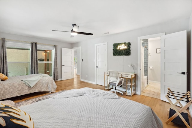 1803 Cedar Ridge Dr, Austin, TX 78741 - bedroom with light wood-style flooring, baseboards, and a ceiling fan