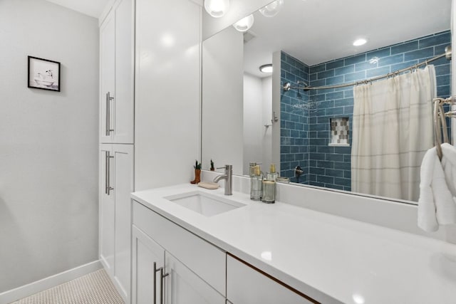 1803 Cedar Ridge Dr, Austin, TX 78741 - full bath with tiled shower, baseboards, vanity, and tile patterned flooring