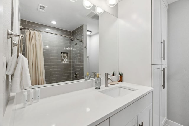 1803 Cedar Ridge Dr, Austin, TX 78741 - full bath featuring tiled shower, vanity, and baseboards