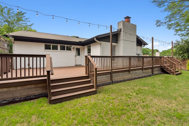 1803 Cedar Ridge Dr, Austin, TX 78741 - back of property with a chimney, a deck, a lawn, and stairs