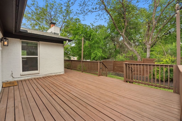 1803 Cedar Ridge Dr, Austin, TX 78741 - deck featuring a fenced backyard and view of wooded area