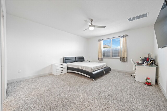 18005 Umberto Dr, Pflugerville, TX 78660 - carpeted bedroom with baseboards and ceiling fan