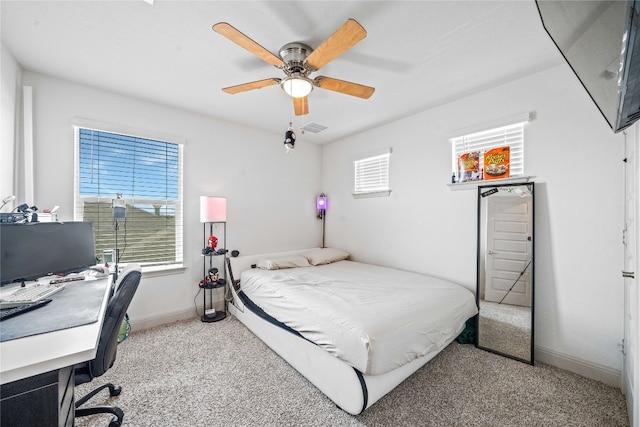 18005 Umberto Dr, Pflugerville, TX 78660 - carpeted bedroom with an office area, baseboards, and a ceiling fan