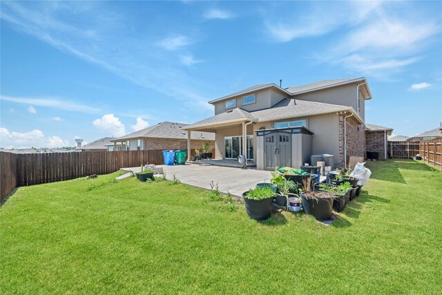 18005 Umberto Dr, Pflugerville, TX 78660 - rear view of property featuring a patio area, a fenced backyard, and stucco siding